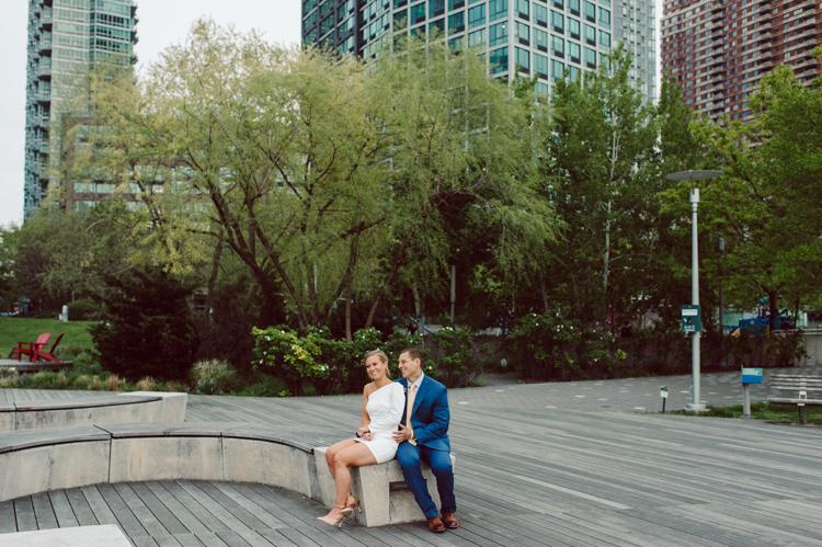 Colleen and Patrick had an intimate wedding ceremony at their church in Queens, NY then we went over to Gantry Plaza State Park LIC for their wedding photos. Colleen and Patrick's NYC elopement was nothing but fabulous and spectacle. When I saw all the food trucks lined up along Gantry Plaza State Park I knew I wanted to use it as our backdrop for Colleen and Patrick. Of course we chose "Mr Softee's Ice Truck" and as we were taking the photo one of Colleen and Patrick's cousin walked by doing the most epic photobomb ever! Colleen and Patrick's NYC elopement Gantry Plaza State Park LIC captured by NY NJ Weddings, Elopements and Family Photographer Karis by Hey Karis.